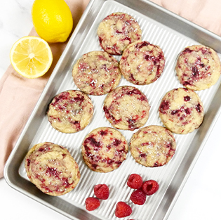 ilemon raspberry cookies on a quarter sheet pan